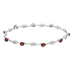 Náramek z bílého zlata s granáty a diamanty. Délka 18,5cm