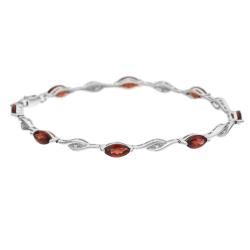 Náramek z bílého zlata s granáty a diamanty. Délka 18,5cm