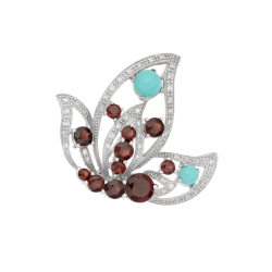 Brož z bílého zlata s granáty, tyrkasy a diamanty. Rozměr 3,60 x 3,50cm